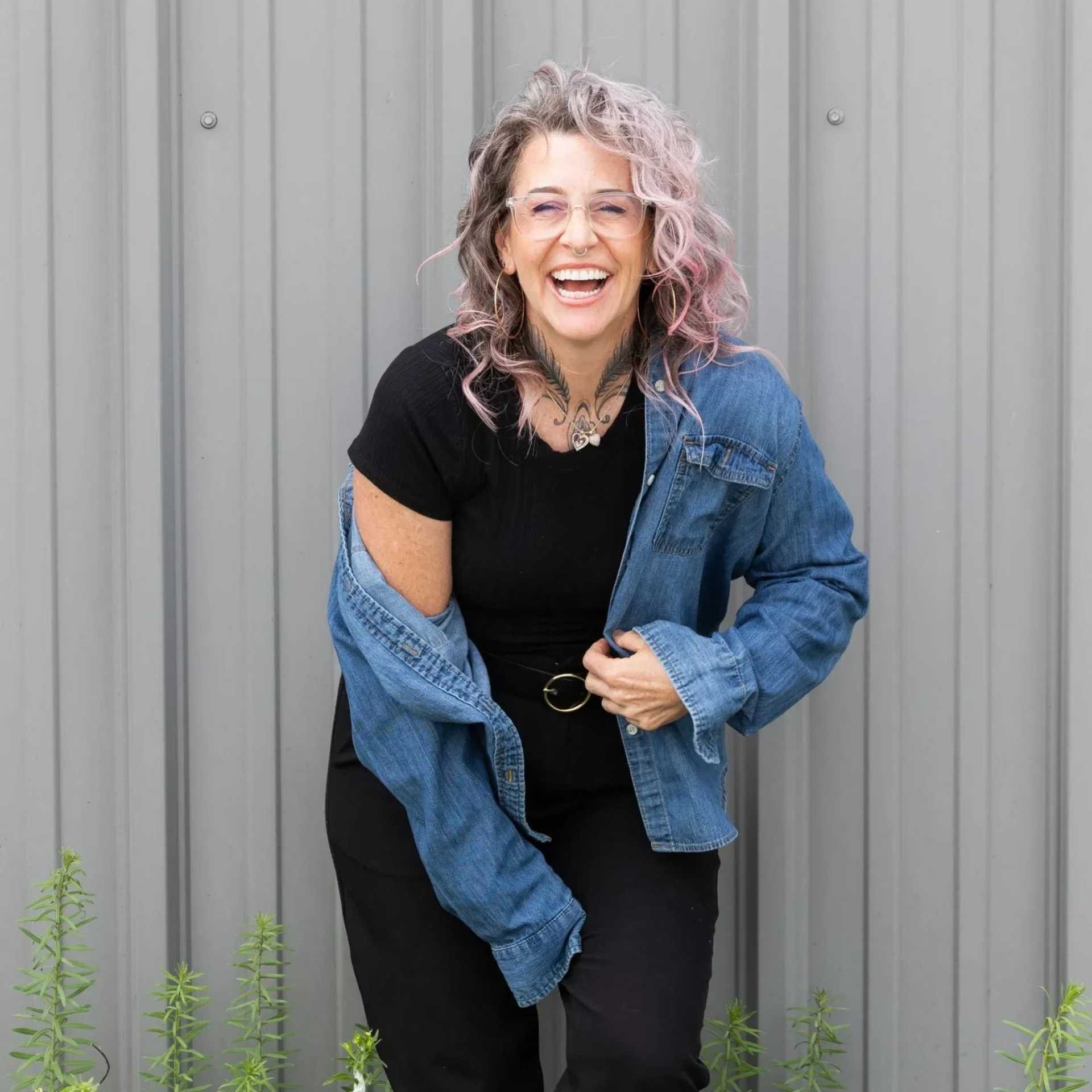 Portrait of Missy Battaglia, a professional stylist at Revolutions Salon, showcasing their expertise and style.